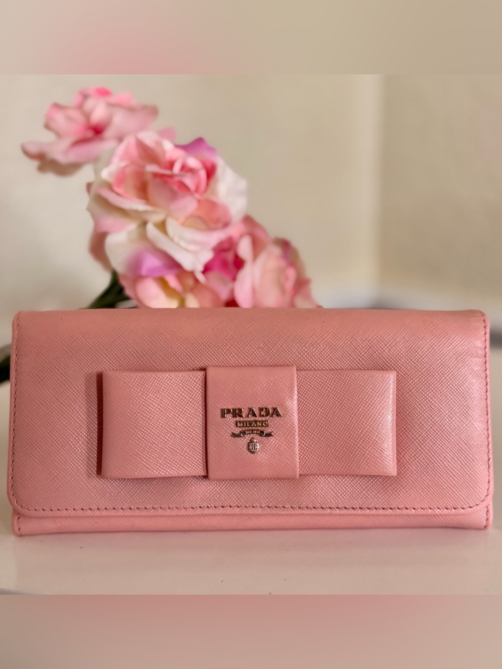 Pink Prada Saffiano leather long wallet flap closure with bow